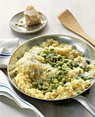 Making risotto with green soya beans