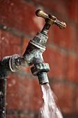 Water running from an old garden tap