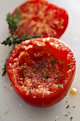 A hollowed out tomato with thyme