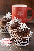 Chocolate cupcakes with coffee cream and sugar decorations