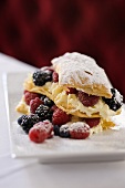 Puff pastries with berries and icing sugar