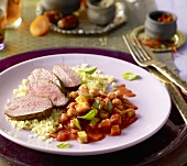 Lamb fillet with couscous and a courgette medley