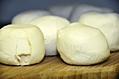Goat's cheeses (Besace Chevre) on a chopping board