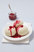 Sweet yeast dumplings with raspberry sauce