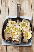 Fried trout with a grape and almond sauce