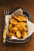 Roasted, salted potatoes on paper