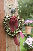 A heart-shaped wreath of hortensia flowers on a door