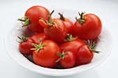 A plate of tomatoes, one deformed