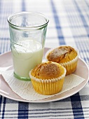 A spiced muffin and a glass of milk