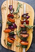 Vegetable kebabs with rosemary, seen from above