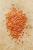 Red lentils on a chopping board