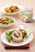 Pork roulade with a mushroom filling, brussels sprots and baked potatoes
