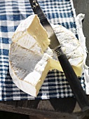 Sliced Camembert with a knife