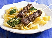 Beef kebabs with tagliatelle and pesto