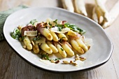 White asparagus with parma ham and pine nuts