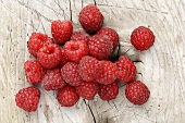 Raspberries on a wooden surface, seen from above