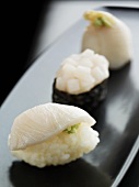 Three sushi with fish