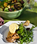 Grilled chicken legs with lemon butter and rocket