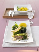 Savoy cabbage parcels with grape sauce