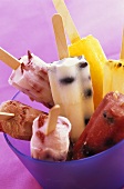 Various ice lollies in a bowl