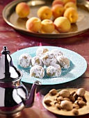 Oriental apricot balls with almonds and icing sugar
