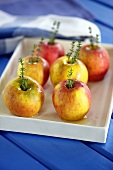 Apples with caramel sauce and rosemary