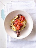 Baked sweet potatoes with caramelised onions and tomatoes