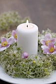 Wreath of clematis seed heads with candle & Japanese anemones