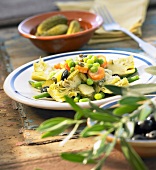 Artichoke and vegetable salad with black olives