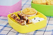 Chicken kebabs with corn muffin and herb dip