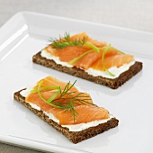Soft cheese, salmon and dill on wholemeal bread