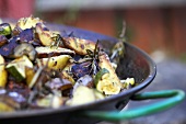 Fried potatoes with rosemary in frying pan