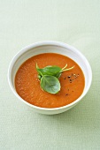 Cold tomato and orange soup with basil