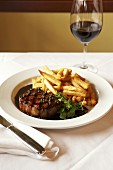 Grilled steak with pepper sauce and chips