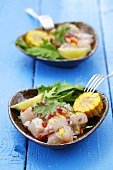 Ceviche with onion and chilli, corn and salad leaves, Peru