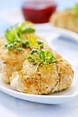 Stuffed turkey rolls with sesame seeds and herbs
