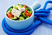 Cucumber and tomato salad with sheep's cheese