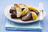 Fried turkey liver with apple wedges