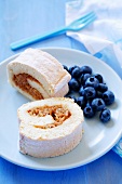 Sponge roll with apple filling and fresh blueberries