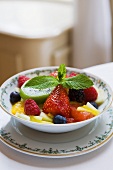 Fruit salad with mint leaves