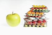 Tablets and capsules in blister packs, apple