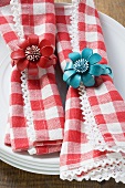 Red and white checked napkins with napkin rings