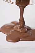 Pouring milk chocolate onto a plate
