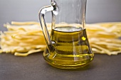Pasta with a carafe of olive oil
