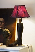 Lamp with a boot-shaped base