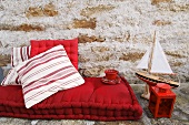 Red floor cushion, maritime decorations