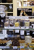 Comfits (candied spices) and chocolates in a sweet shop