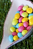 Coloured sugar eggs in a dish