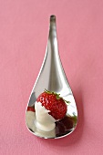 Strawberry with crème fraîche on spoon