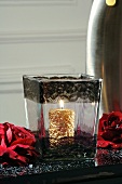 Gold candle in glass